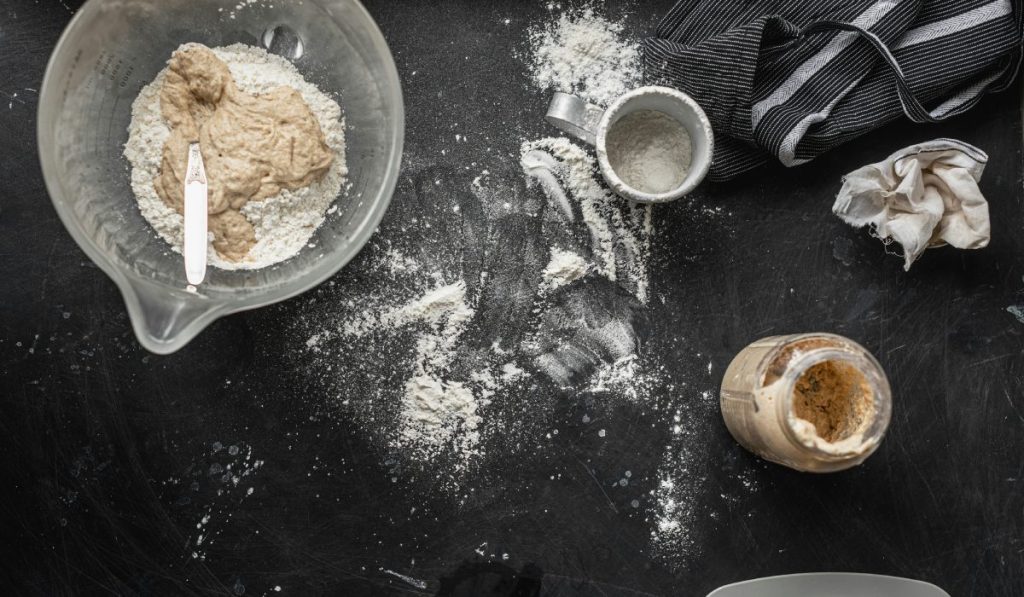 Gluten-Free Sourdough Starter on the table with Bowl for mixing Bread