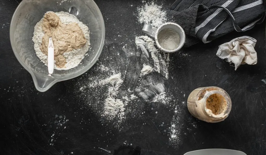 Gluten-Free Sourdough Starter on the table with Bowl for mixing Bread