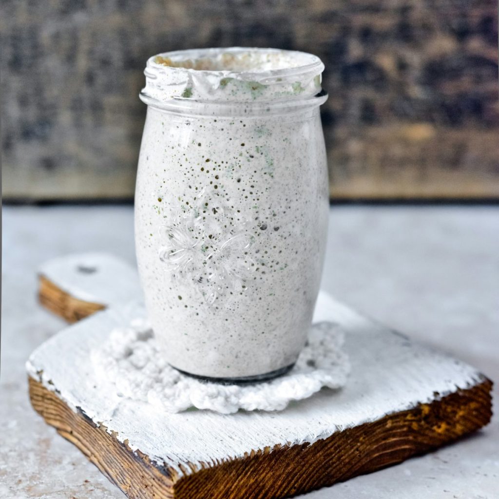 Gluten-free Sourdough Starter in Glass Jar on the Wooden board
