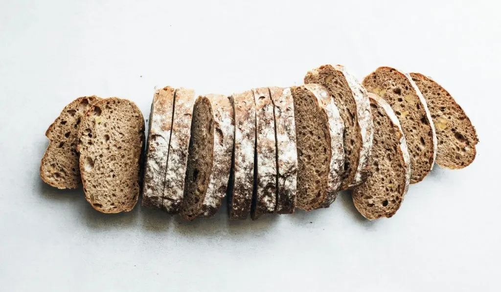 sliced high fiber bread on white surface