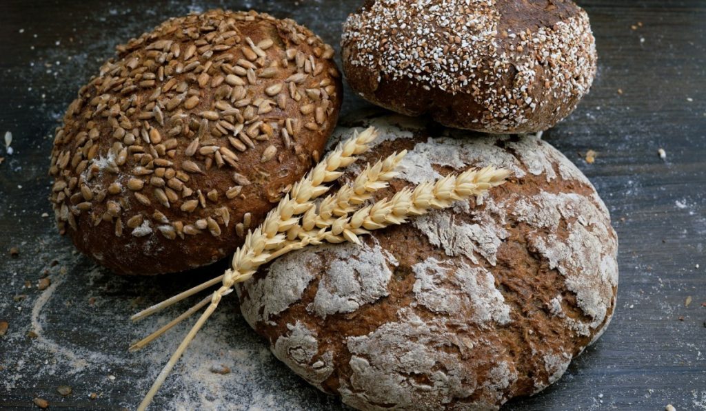 Three types of whole grain bread on a table