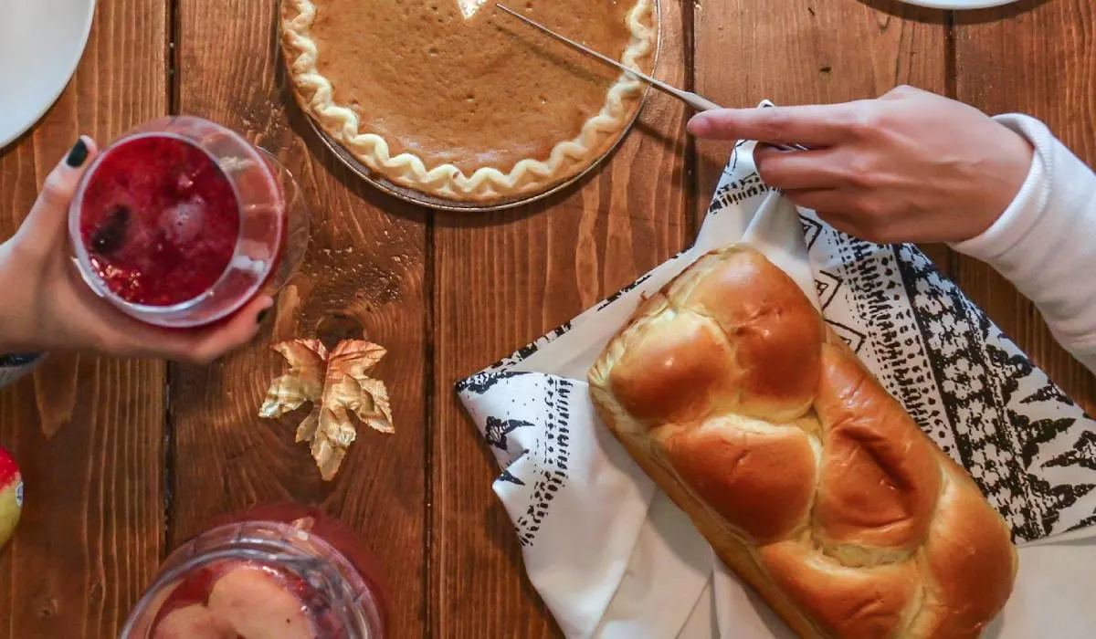 Thanksgiving bread, Slicing of Pumpkin Pie Placed on Wooden Surface