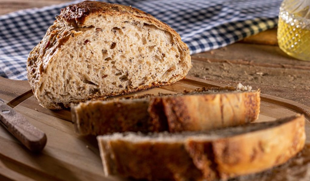 Sliced bread on a wooden plate