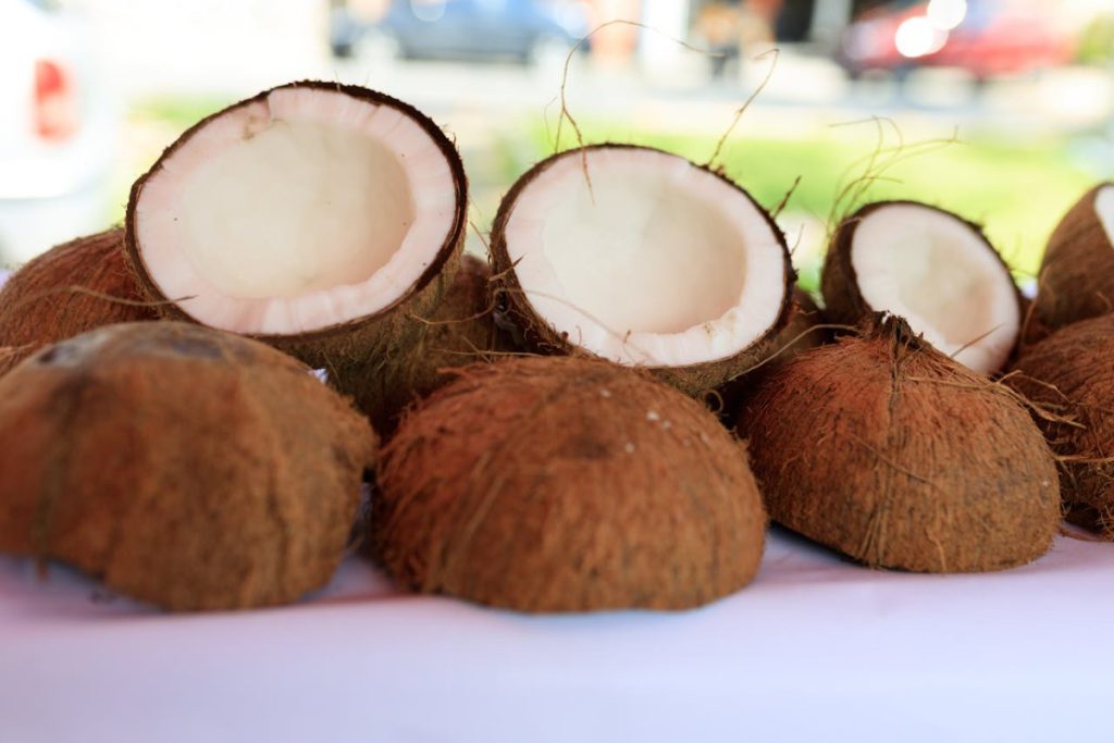 Half cutted coconuts on a table cloth