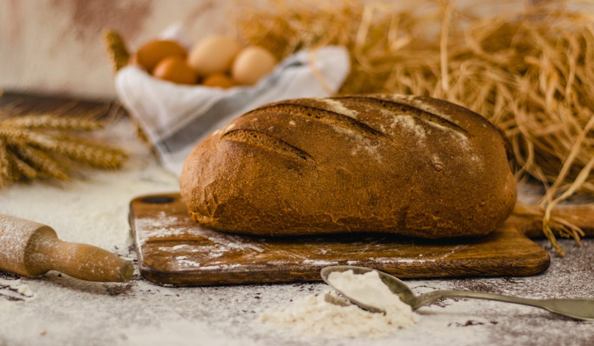Rustic Bread Loaf on Wooden Cutting Board Low FODMAP Bread