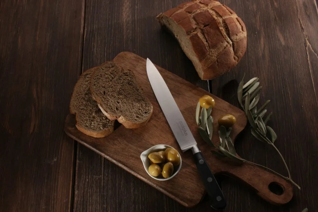 Olive and Rosemary bread on a wooden plate