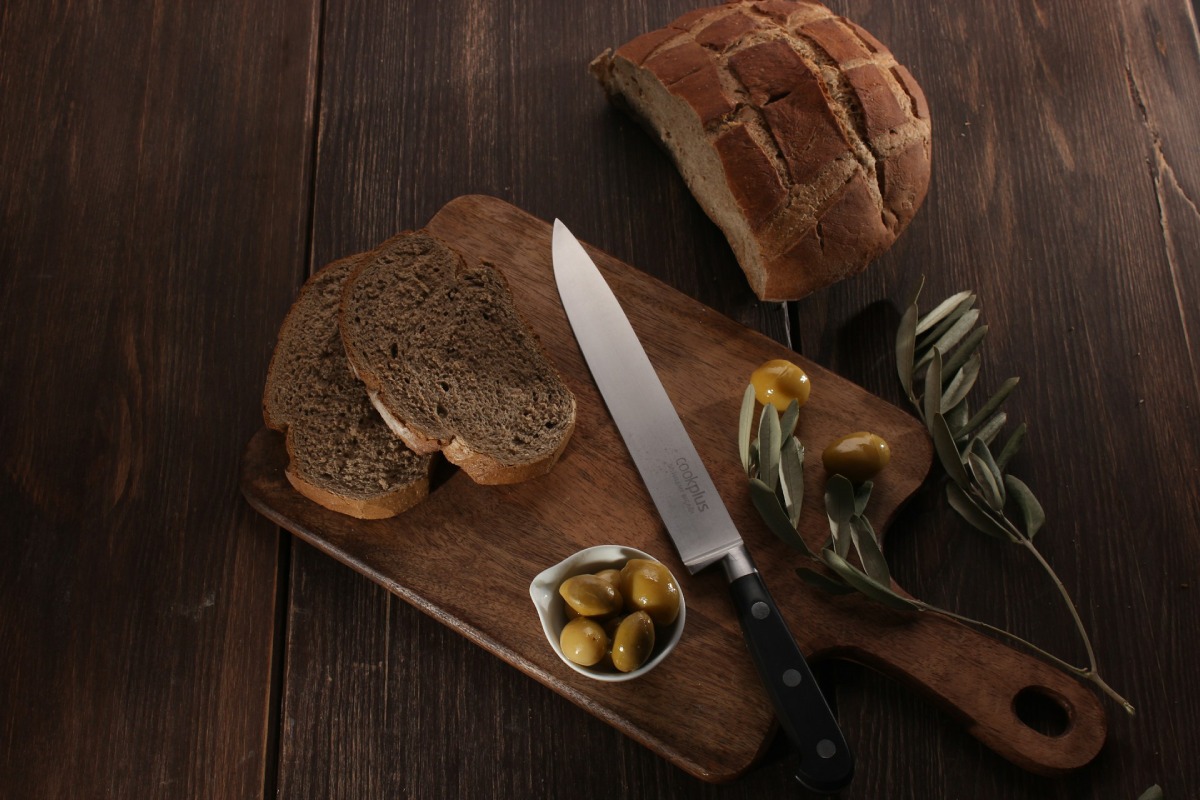 Olive and Rosemary bread on a wooden plate